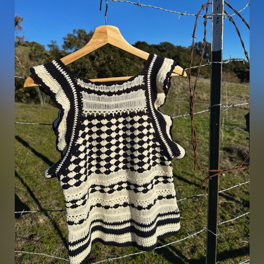 Black and white crocheted short sleeve shirt. Size medium